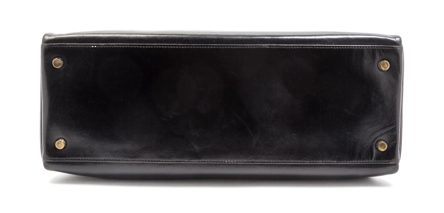 An Hermes 35cm Black Leather Kelly Bag, 13 1/2 x 9 1/2 x 5 inches.