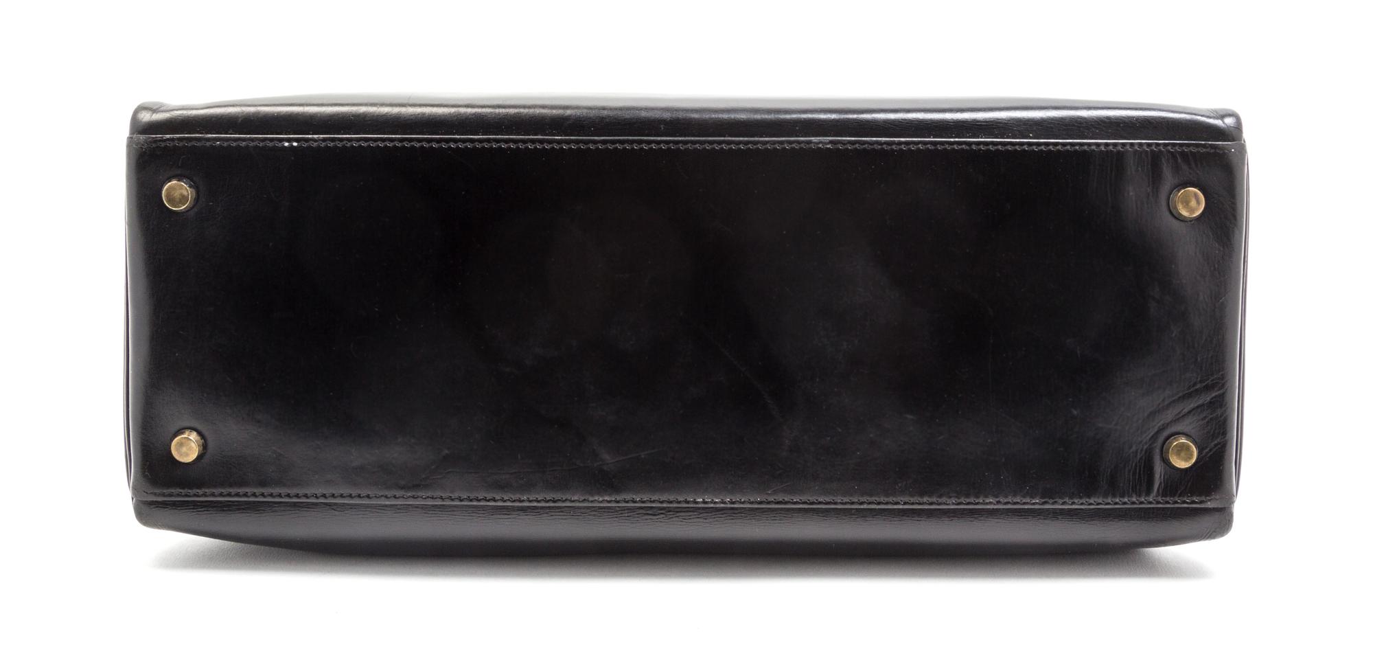 An Hermes 35cm Black Leather Kelly Bag, 13 1/2 x 9 1/2 x 5 inches.