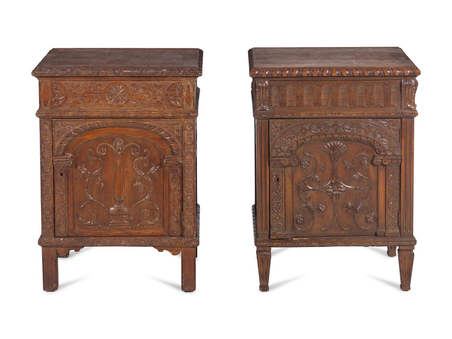 A Near Pair of Renaissance Style Carved Oak Side Cabinets