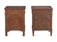 A Near Pair of Renaissance Style Carved Oak Side Cabinets