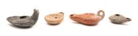 A Group of Four Roman Oil Lamps Height of largest 2 x width 4 inches. — CIRCA 1ST-3RD CENTURY C.E.