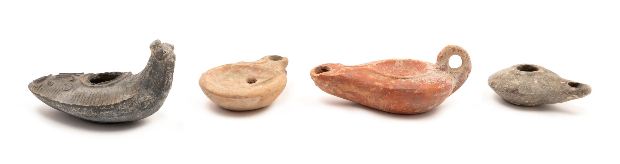 A Group of Four Roman Oil Lamps Height of largest 2 x width 4 inches. — CIRCA 1ST-3RD CENTURY C.E.