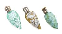 English, LATE 19TH CENTURY, three silver mounted cameo glass perfume bottles, each of tapering form with floral decoration