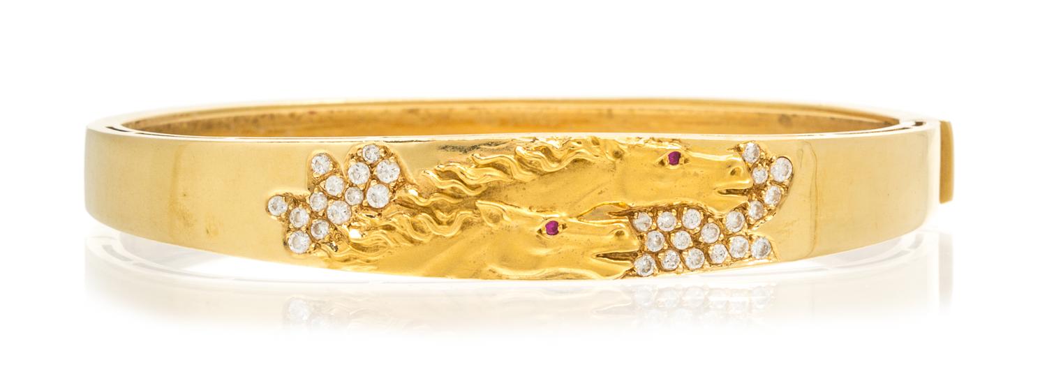 An 18 Karat Yellow Gold, Diamond and Ruby Horse Motif Bracelet, 16.30 dwts.