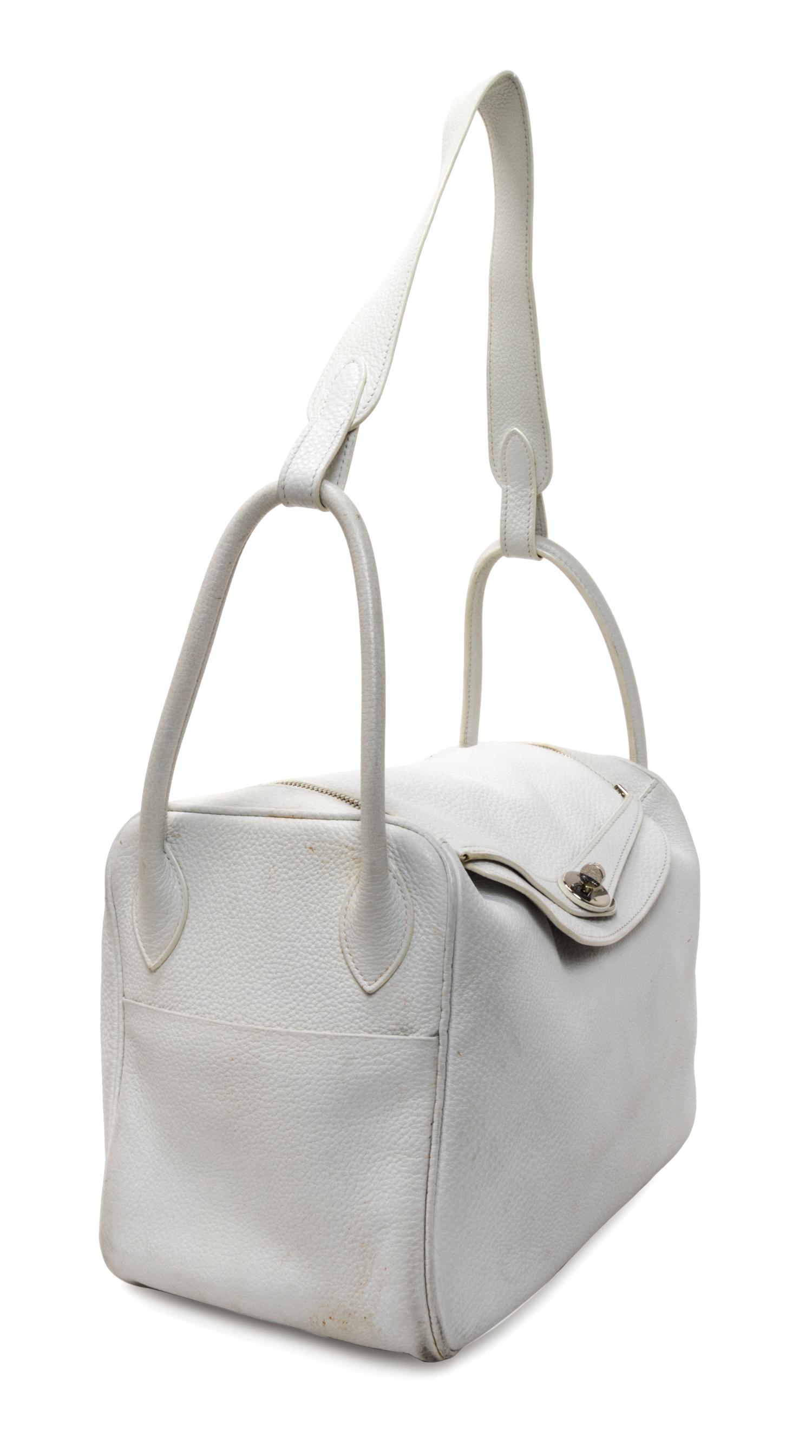An Hermes White Taurillon Clemence Lindy 34 Handbag, 13.5" x 8" x 7".