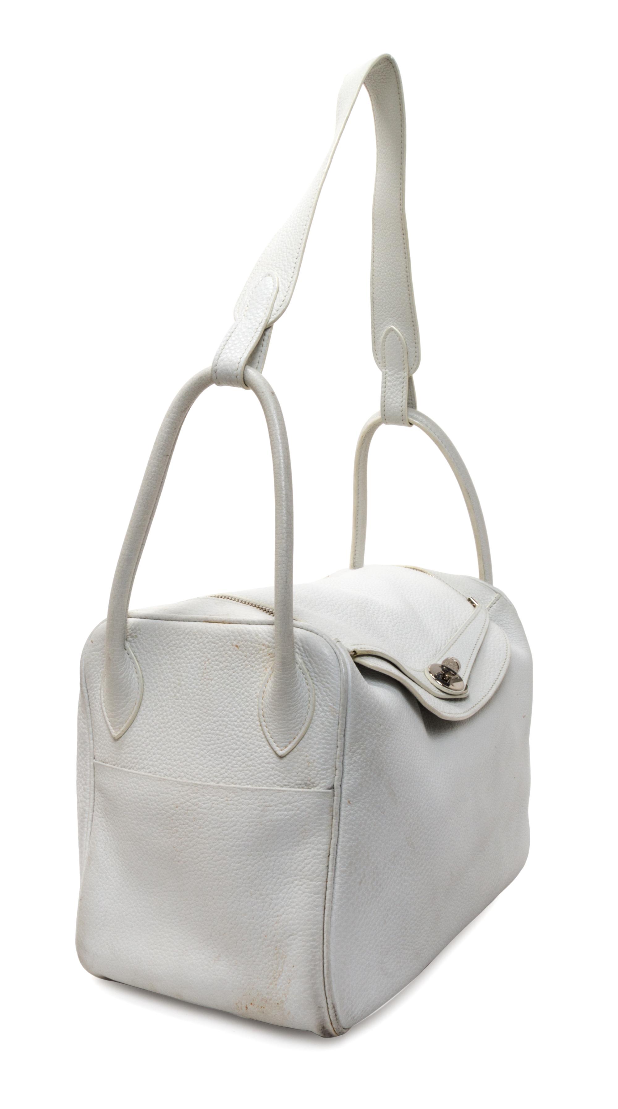 An Hermes White Taurillon Clemence Lindy 34 Handbag, 13.5" x 8" x 7".