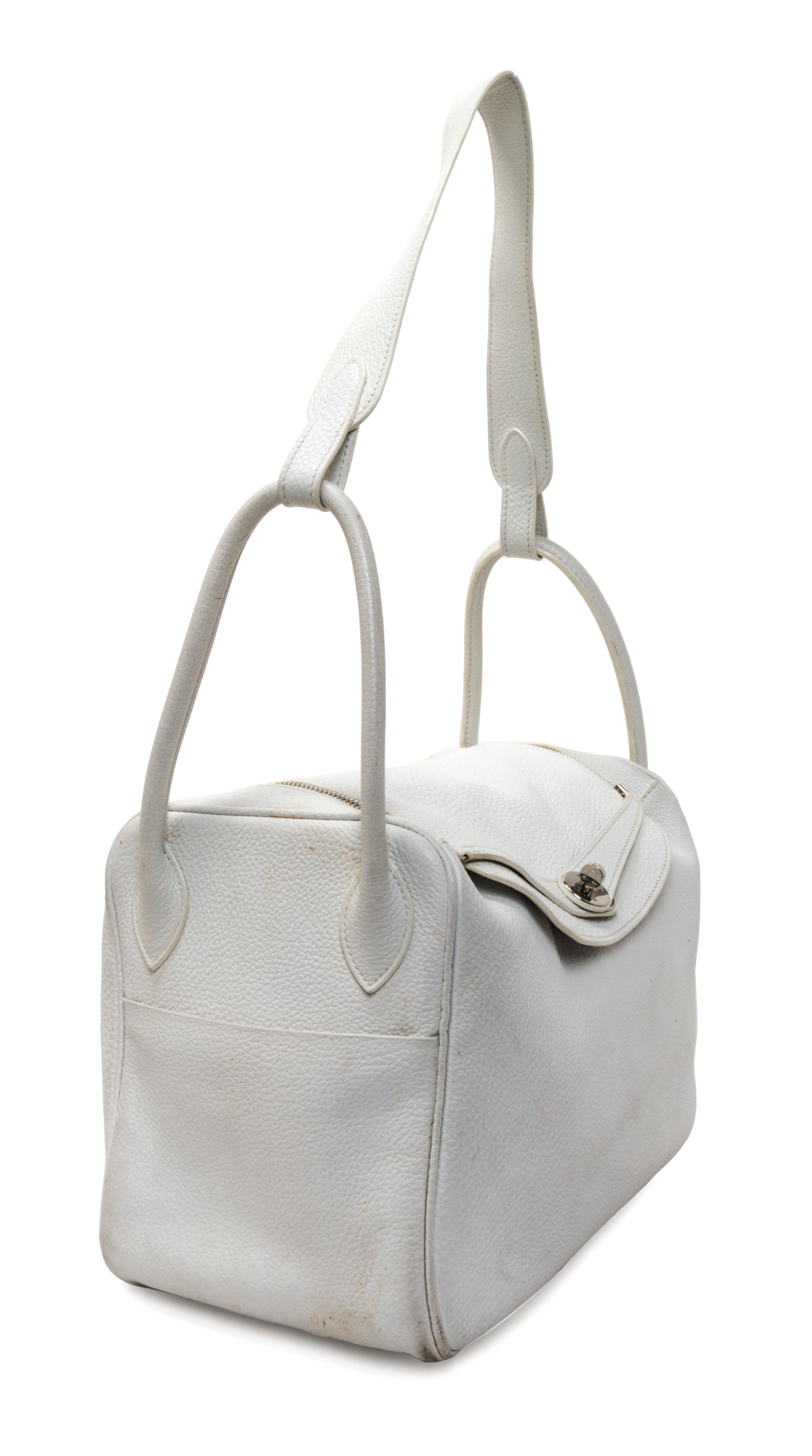 An Hermes White Taurillon Clemence Lindy 34 Handbag, 13.5" x 8" x 7".