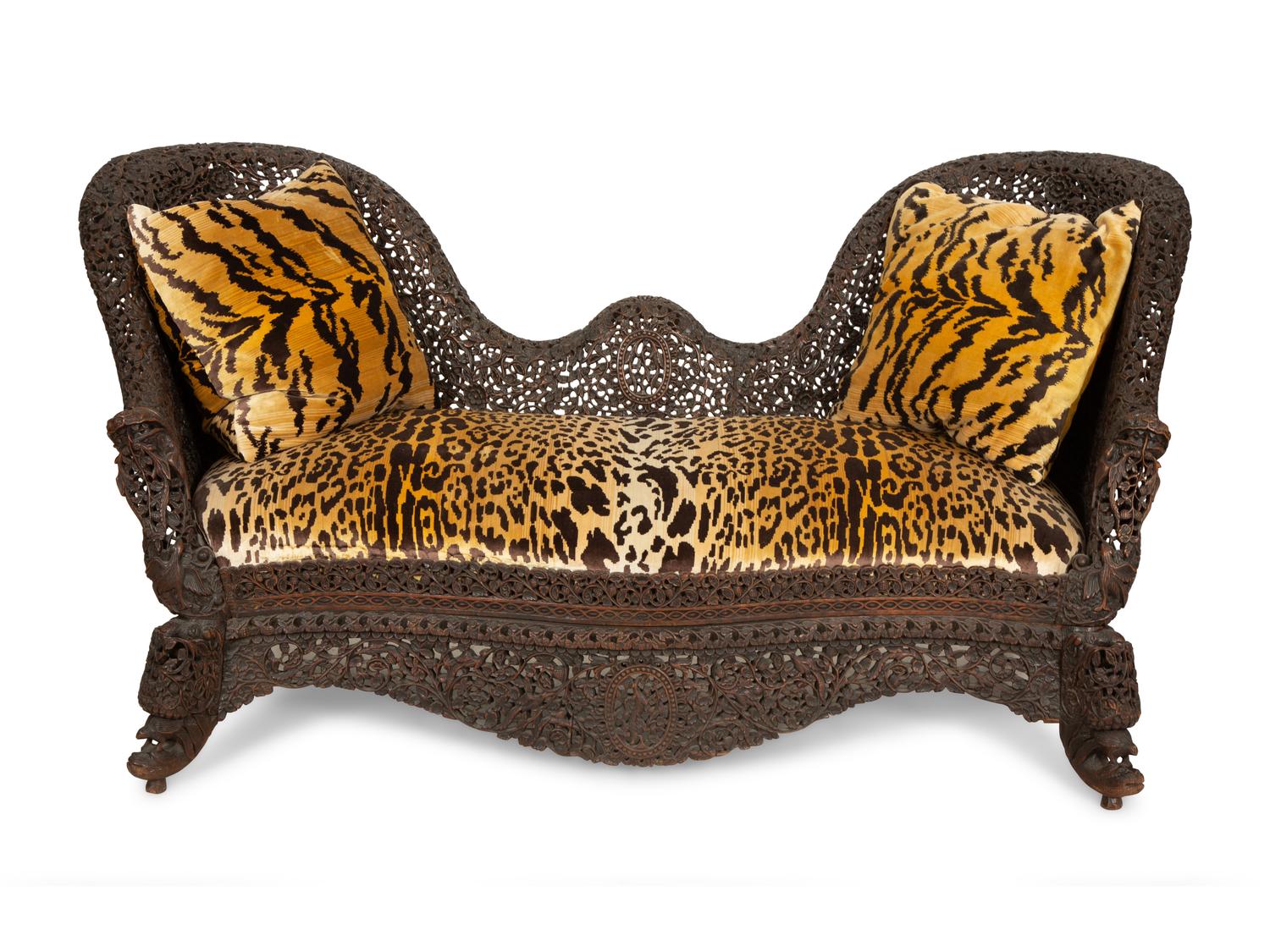 Two Similar Anglo-Burmese Carved Teak Settees