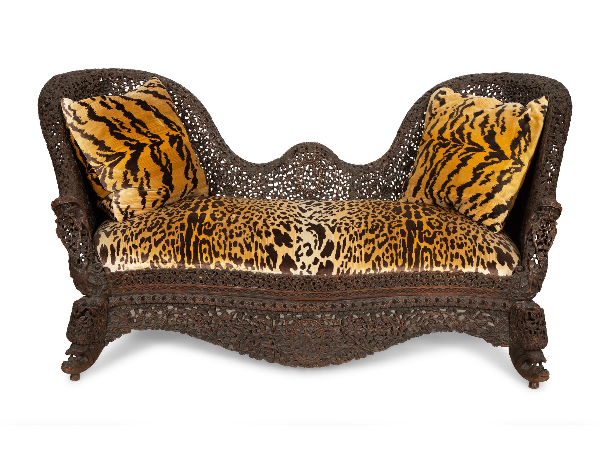 Two Similar Anglo-Burmese Carved Teak Settees