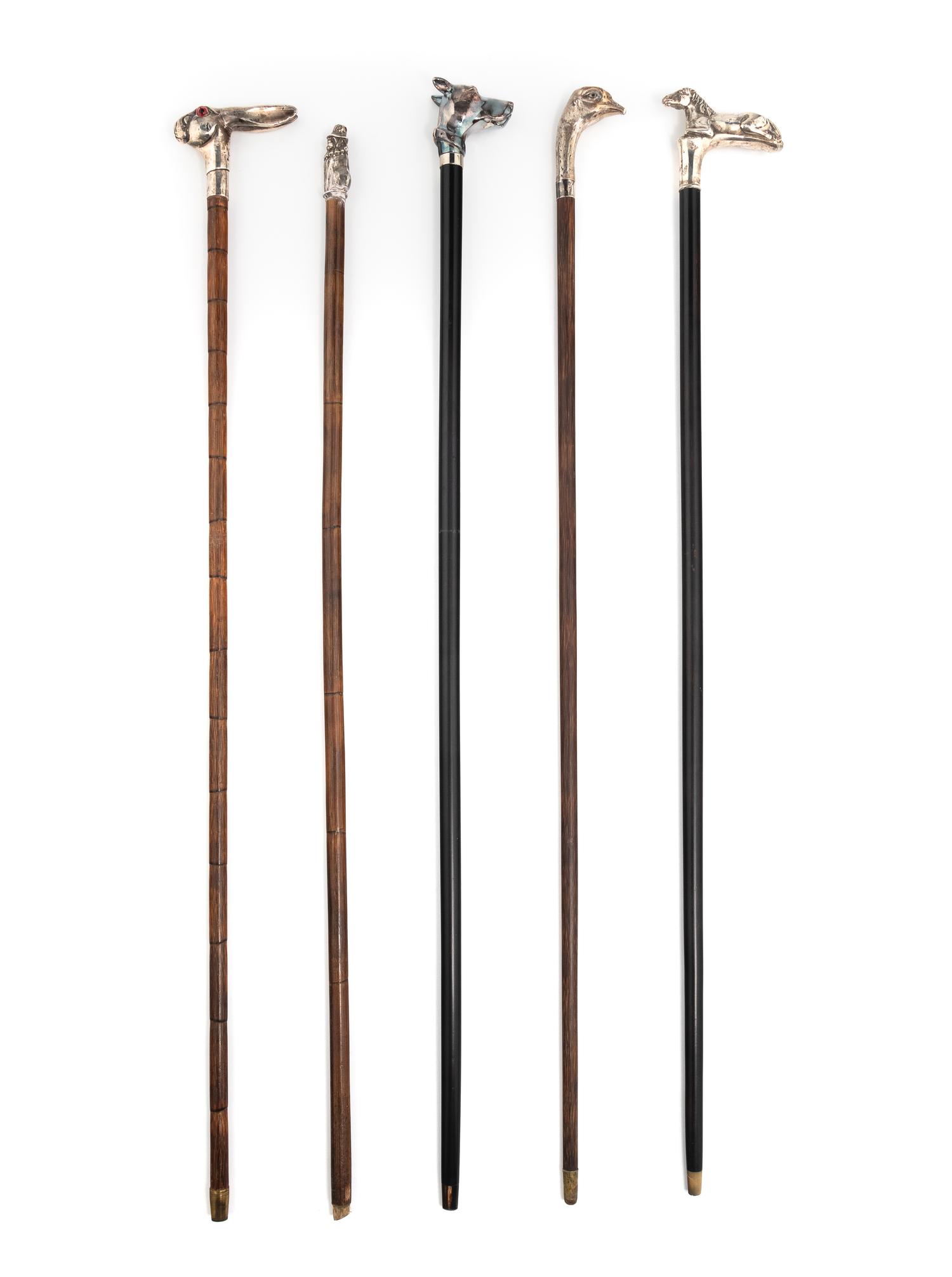 A Group of Five Silver Mounted Zoomorphic Walking Sticks