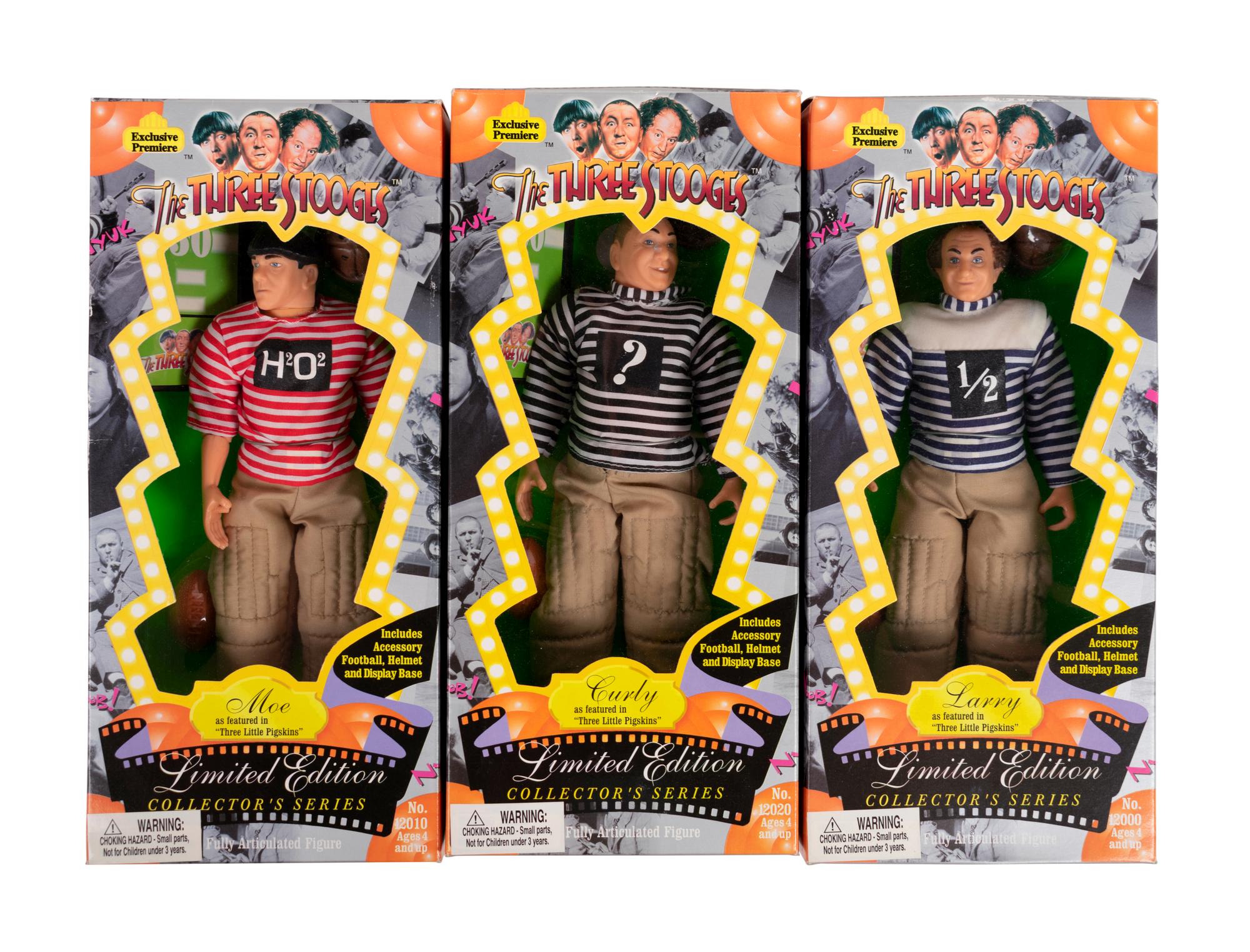 (Film Memorabilia) A group of 5 dolls from three comedies, comprising: