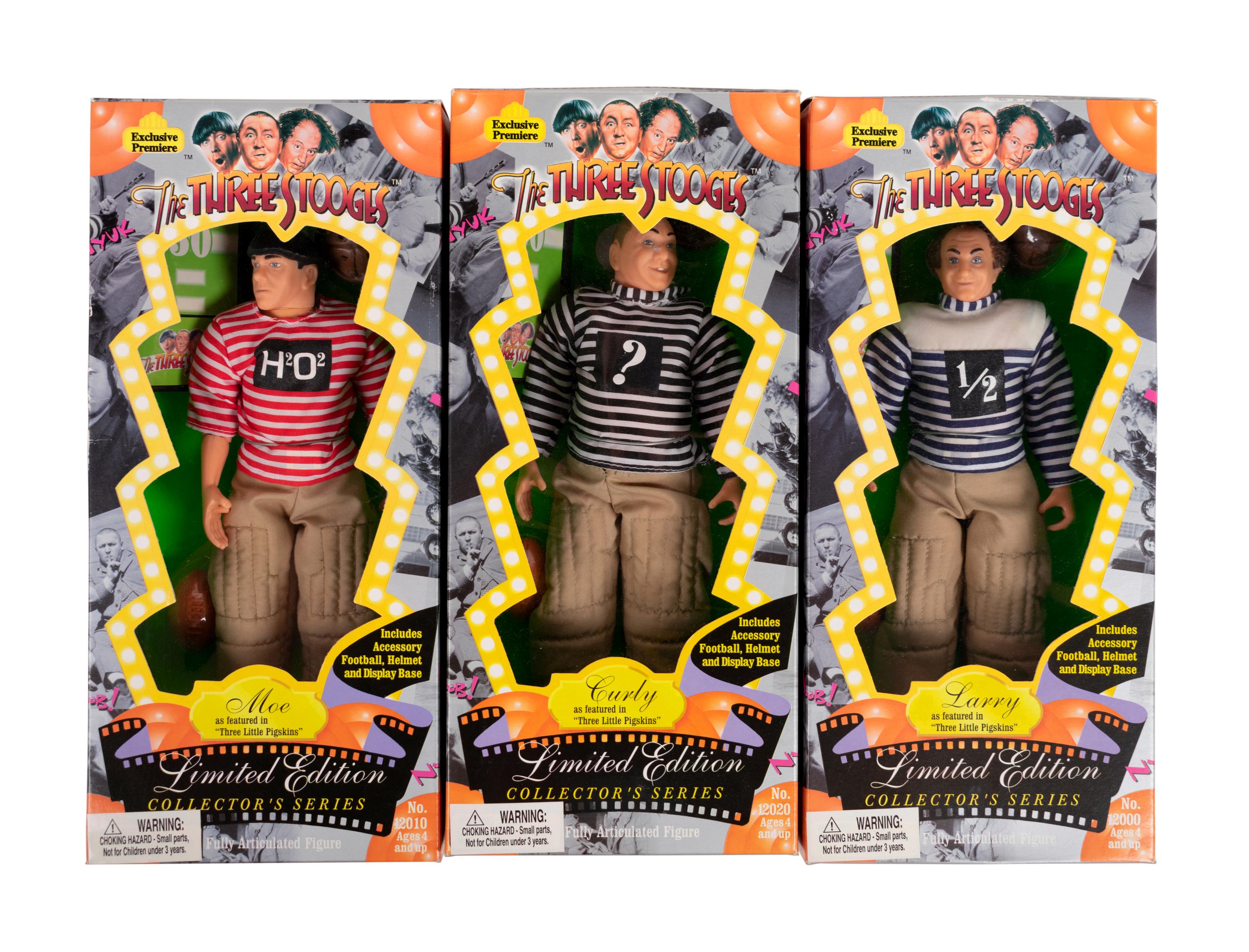 (Film Memorabilia) A group of 5 dolls from three comedies, comprising: