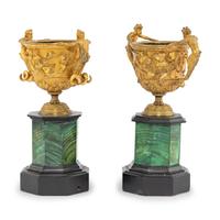 A Near Pair of Gilt-Bronze Urns on Malachite Stands