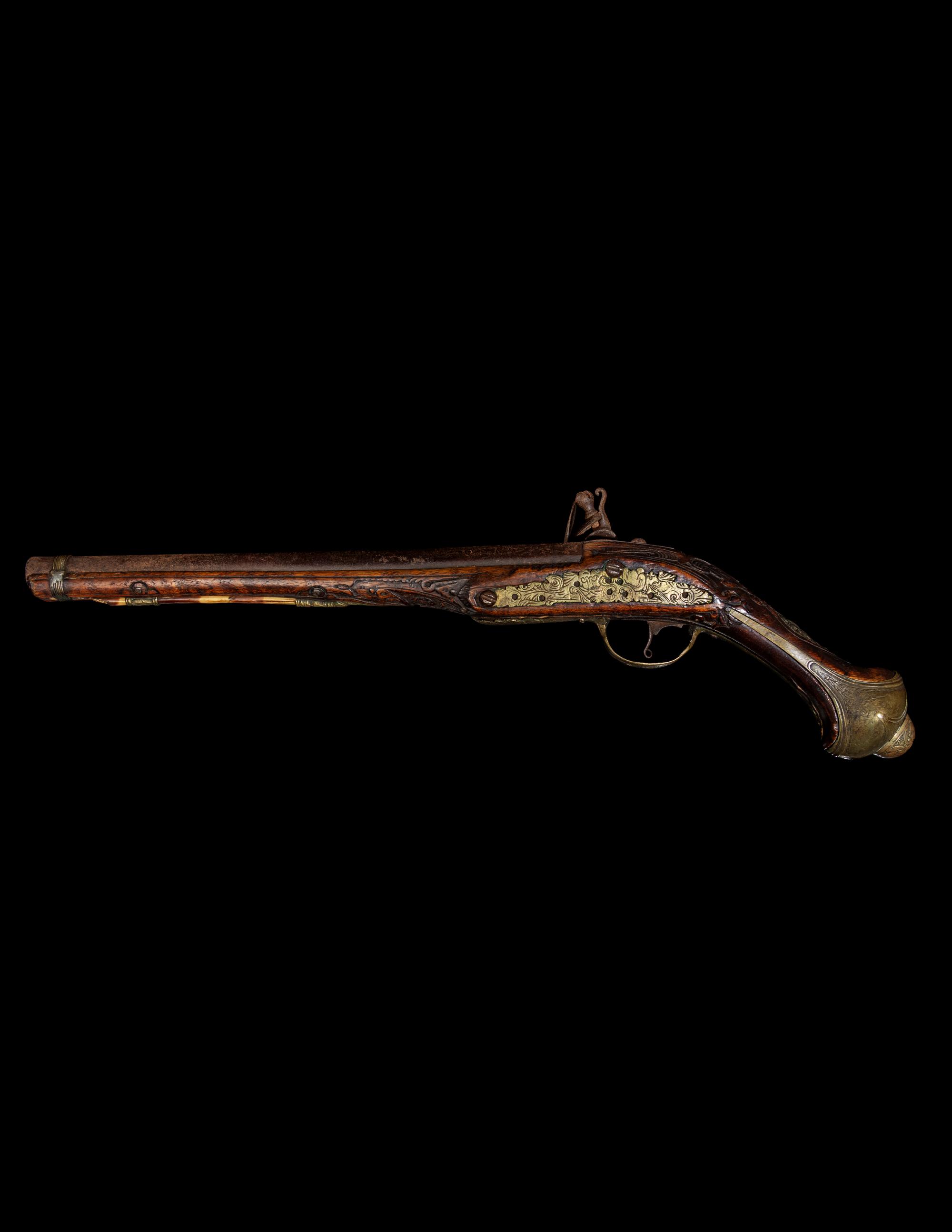 An Engraved Brass-Mounted Flintlock Pistol
