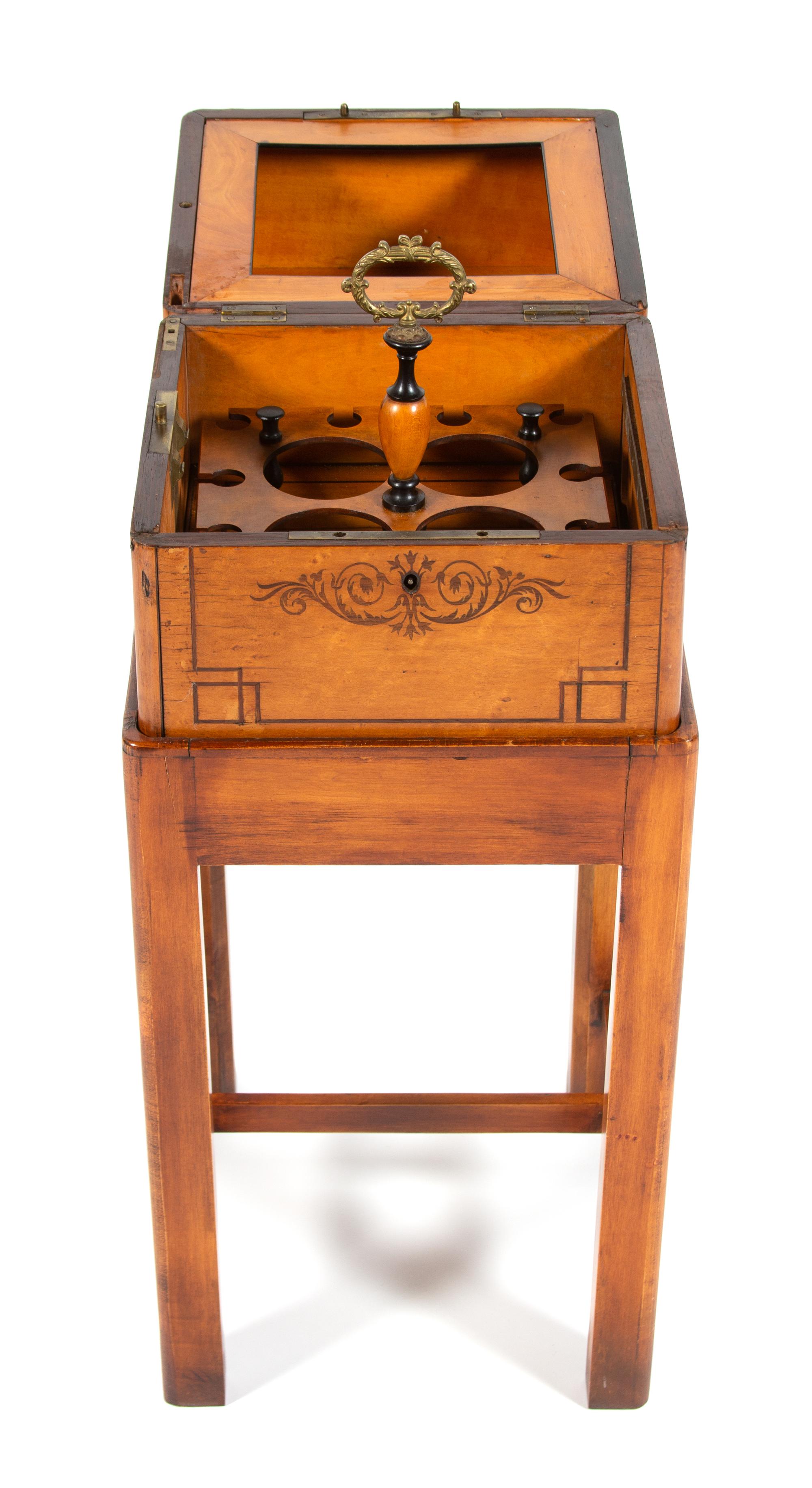 A Charles X Style Birds-Eye Maple Liqueur Chest on Stand Height 29 1/2 x width 12 3/4 x depth 12 3/4 inches. — 19TH CENTURY