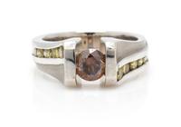A 14 Karat White Gold, Fancy Colored Diamond and Treated Diamond Ring, 11.30 dwts.