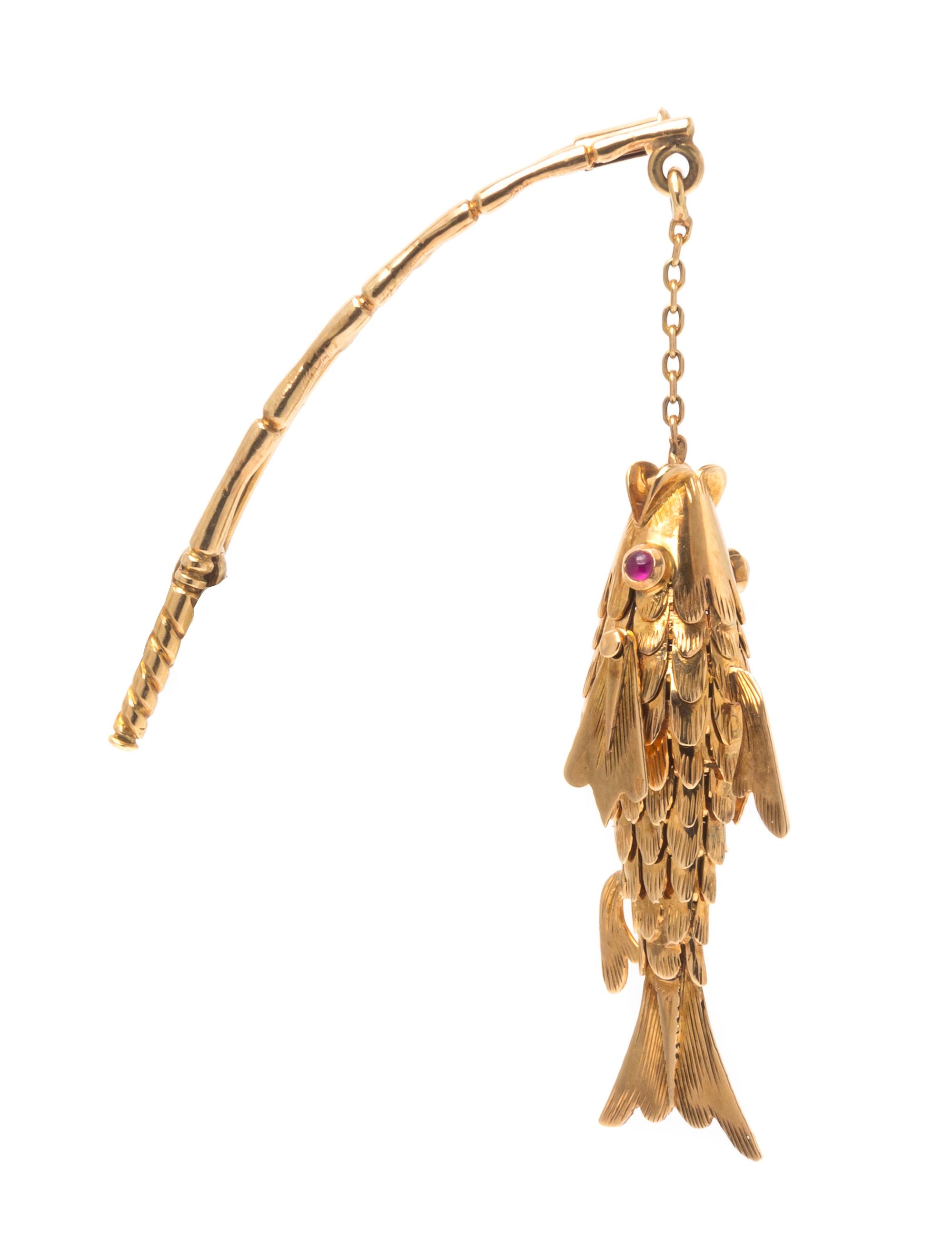 A Yellow Gold Articulated Fish and Rod Brooch, 5.60 dwts.