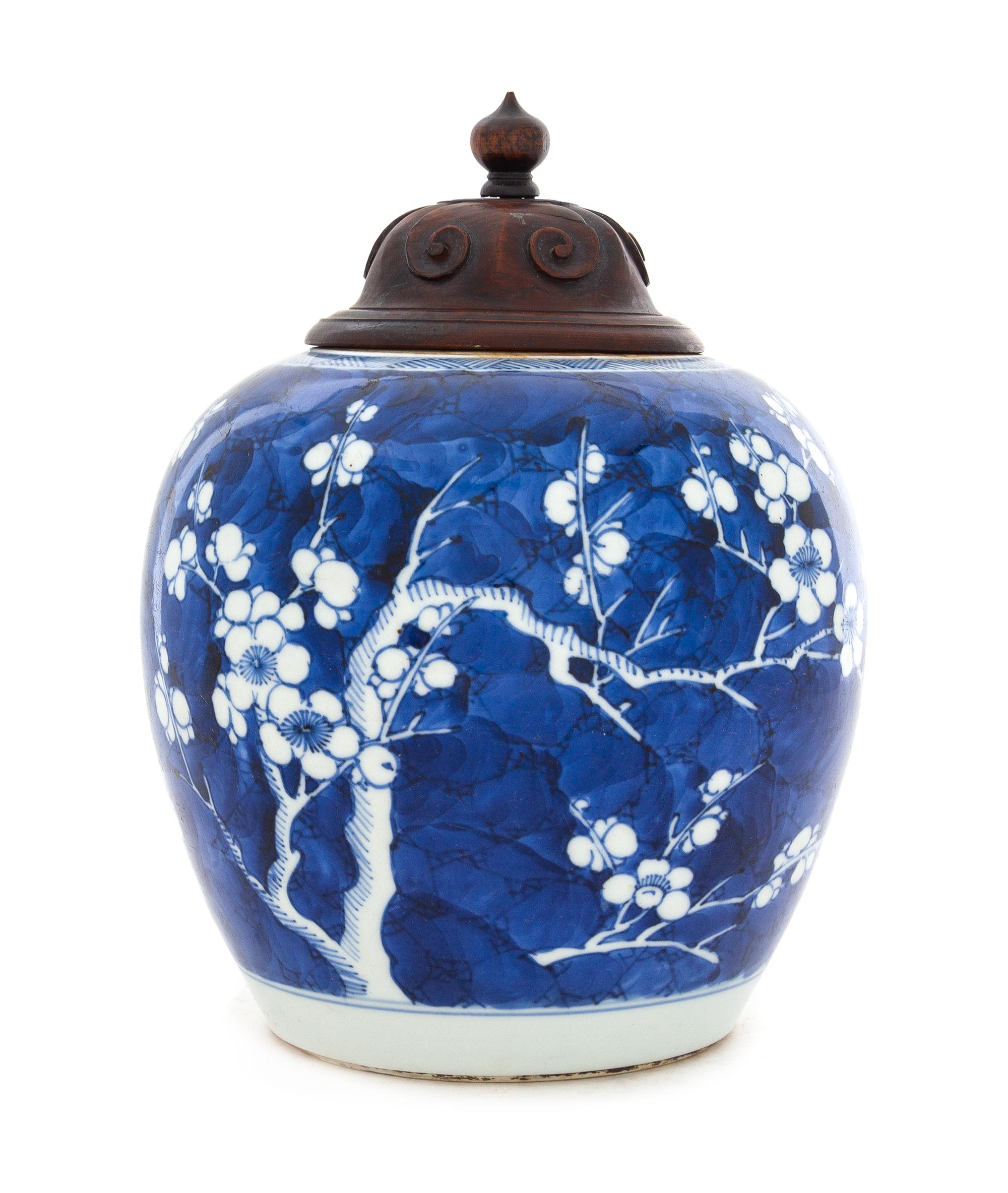 A Chinese Blue and White Porcelain "Crackled Ice and Prunus" Ginger Jar Height 6 1/4 inches. — 19TH CENTURY