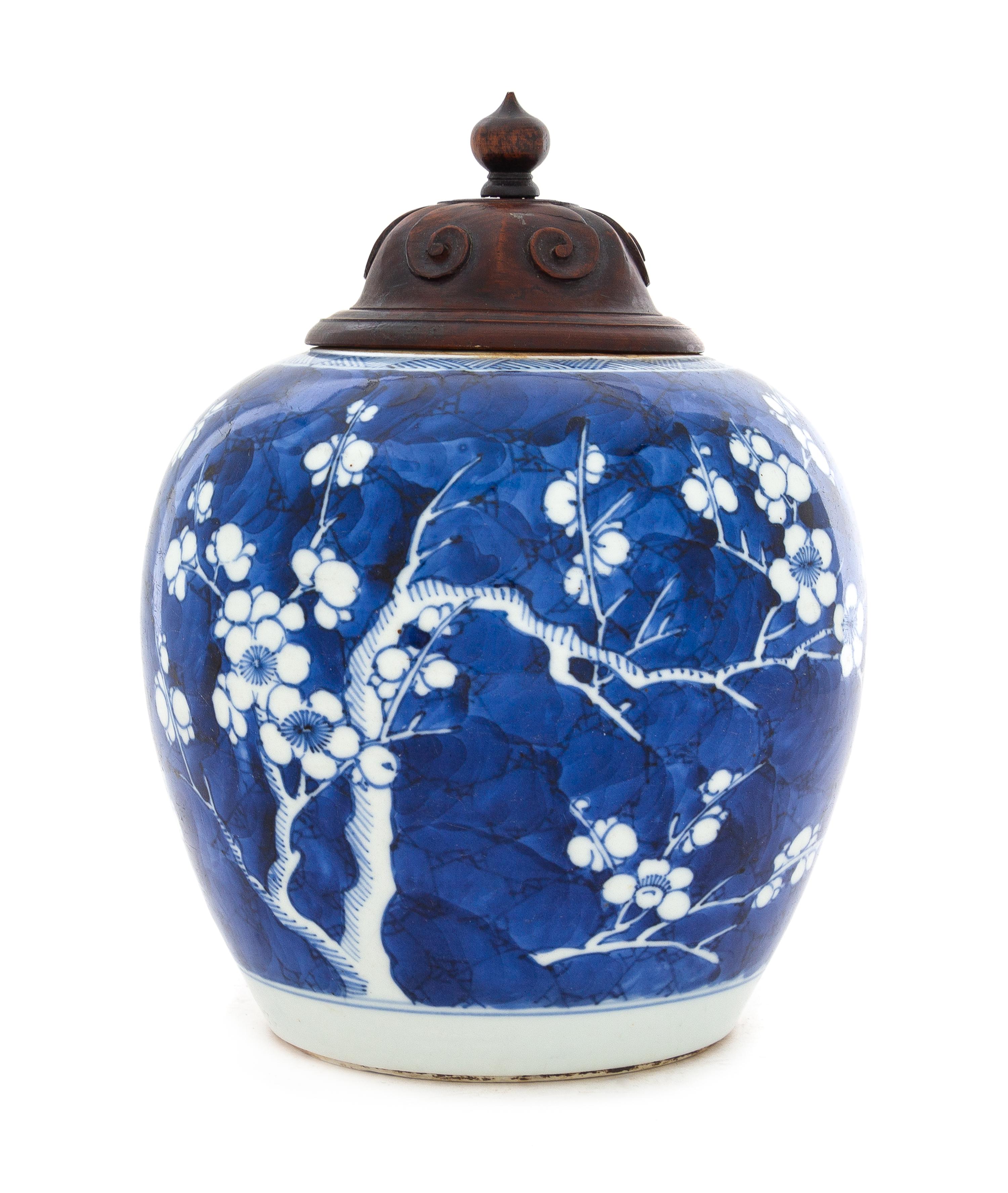 A Chinese Blue and White Porcelain "Crackled Ice and Prunus" Ginger Jar Height 6 1/4 inches. — 19TH CENTURY