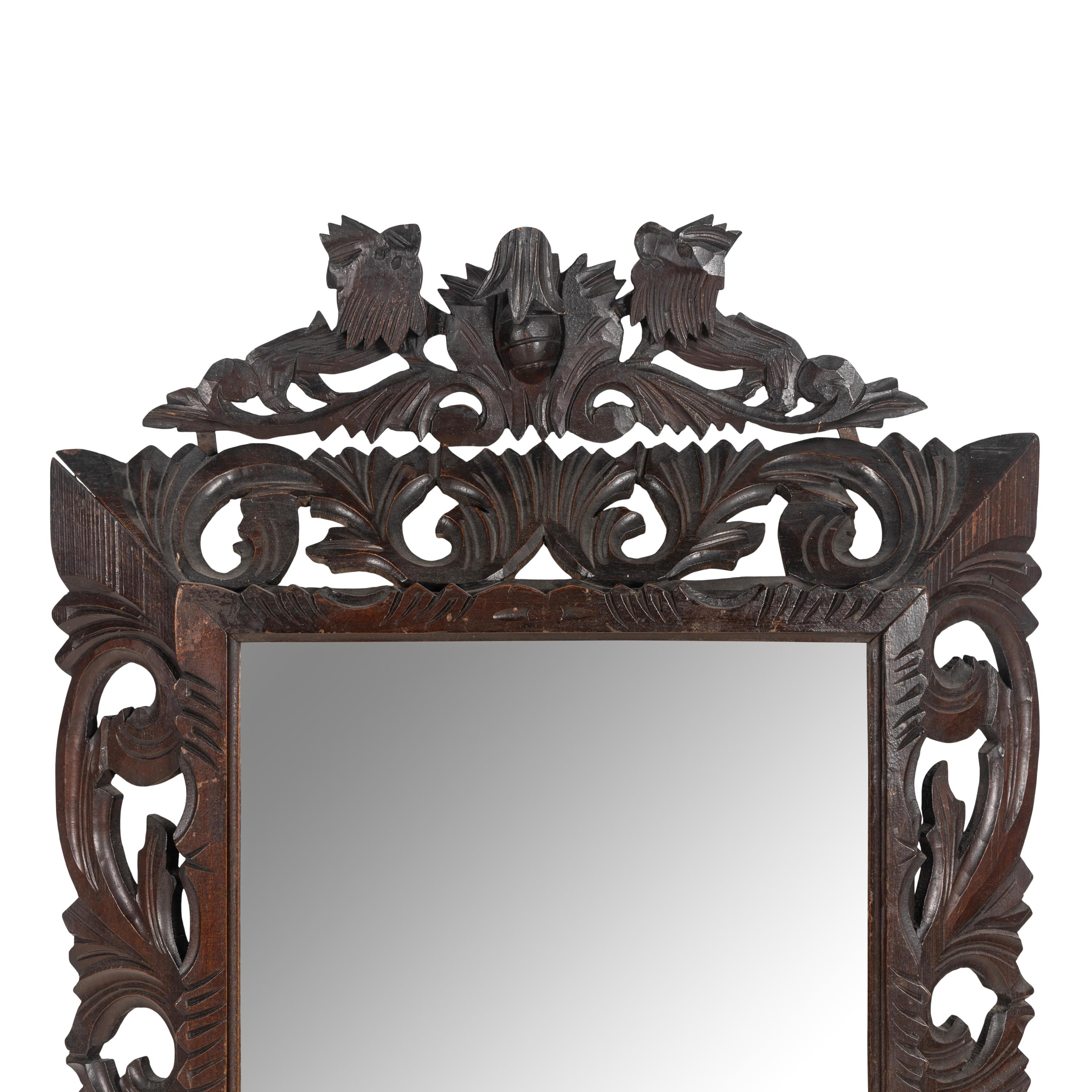 An Italian Carved Oak Mirror