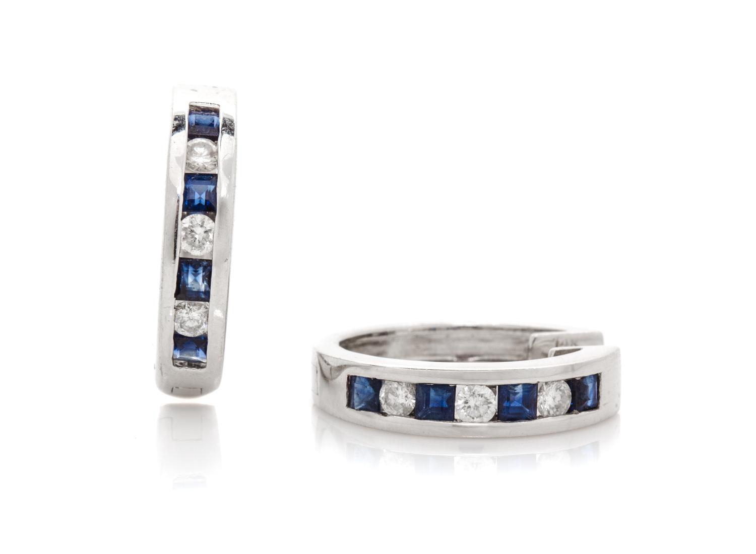 A Pair of 14 Karat White Gold Diamond and Sapphire Earrings, 4.30 dwts.