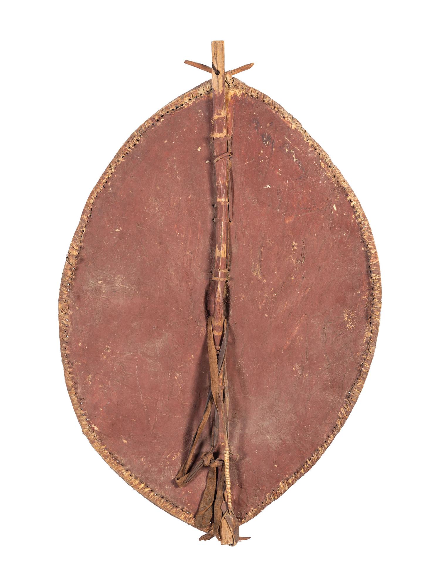 A Painted Leather African Shield and a Painted Wood Board Depicting an African Mask