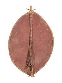A Painted Leather African Shield and a Painted Wood Board Depicting an African Mask