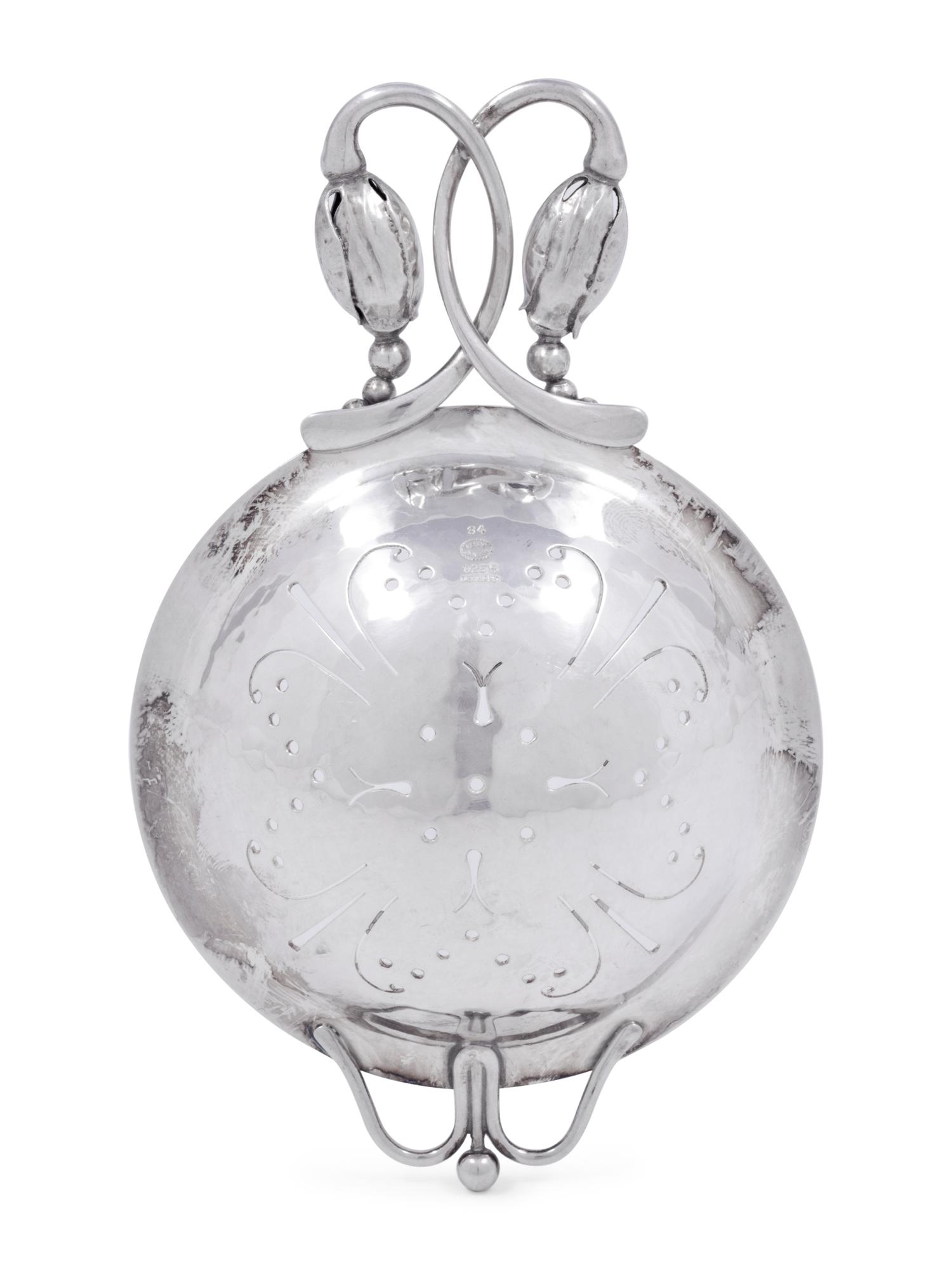 A Georg Jensen Silver Blossom Pattern Tea Strainer