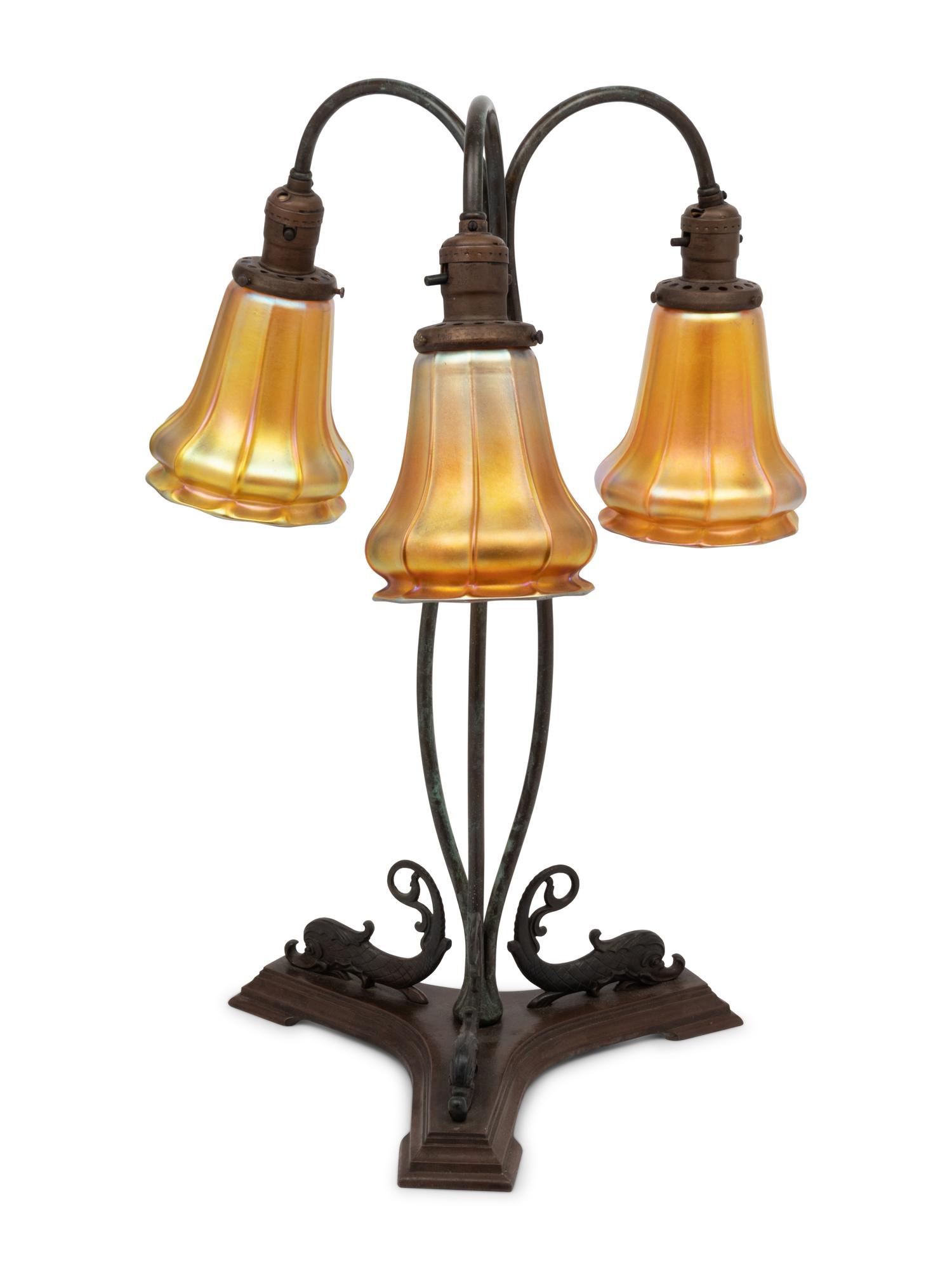A Cast Metal Three-Light Lamp with Quezal Aurene Glass Shades