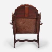 A carved mahogany and tooled leather Campeche chair Mexico, late 18th / early 19th century