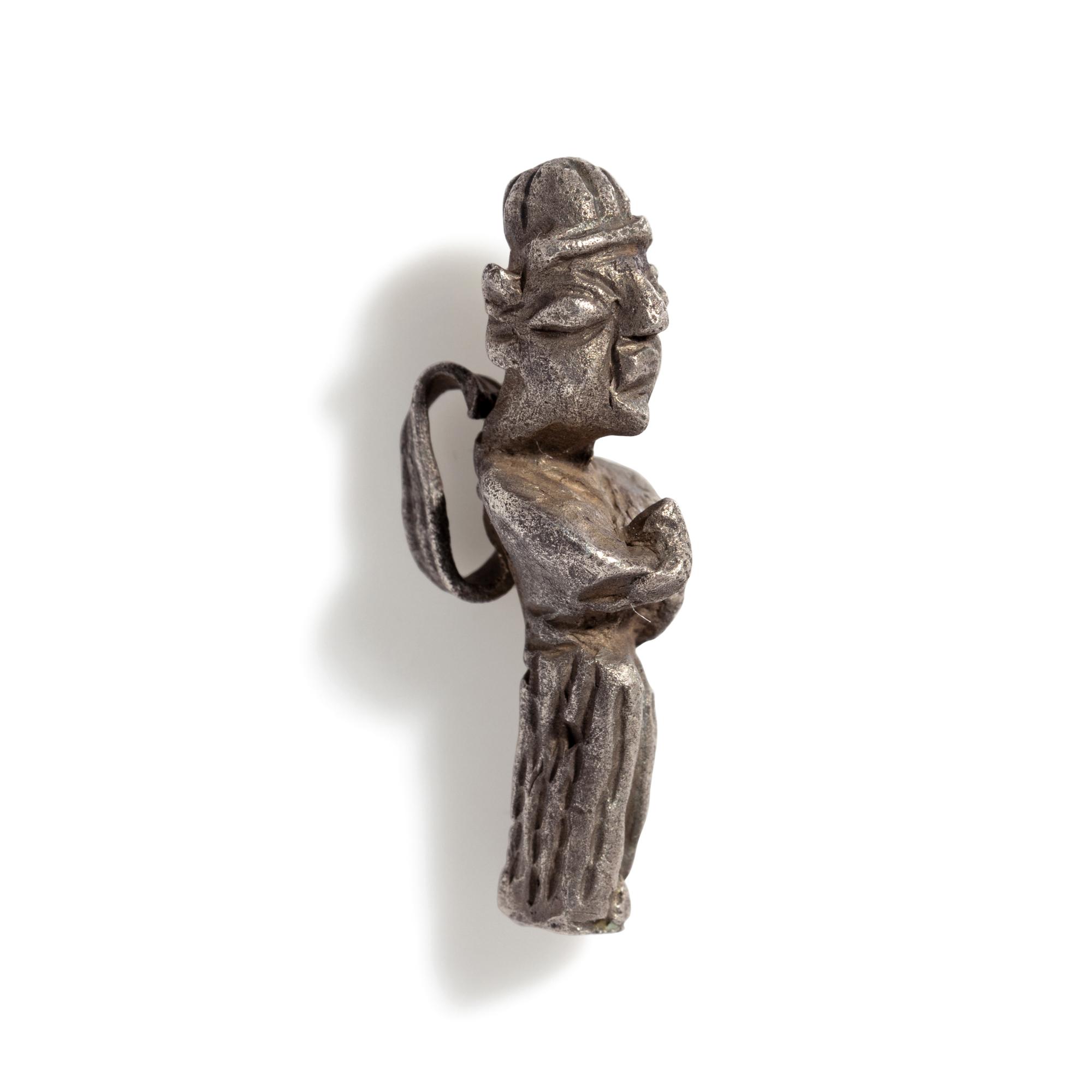 A Phoenician Silver Pendant of a Deity