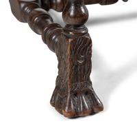 A Louis XIII Carved Walnut Fauteuil