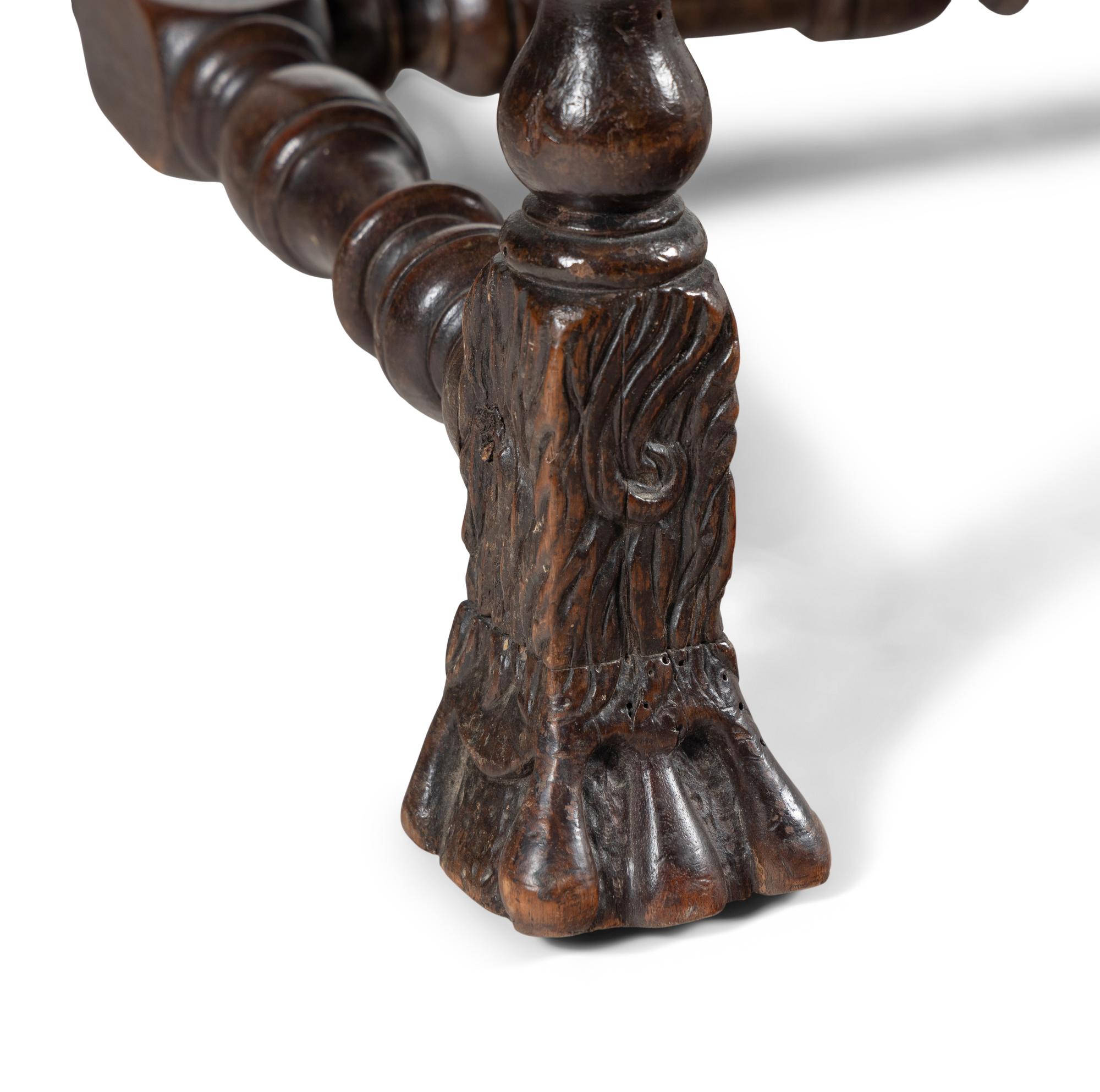 A Louis XIII Carved Walnut Fauteuil