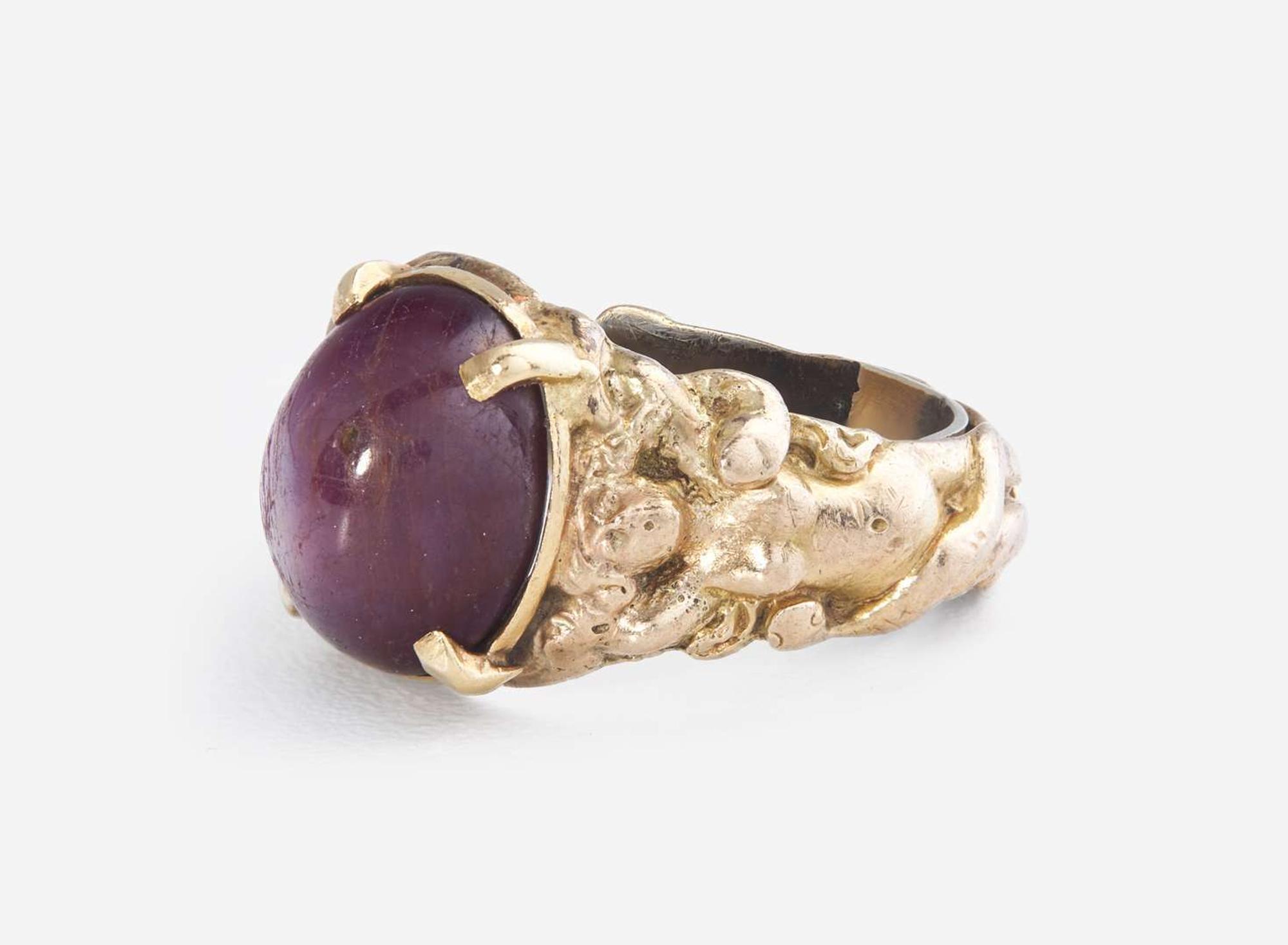 A Men's 10K Yellow Gold and Star Ruby Ring
