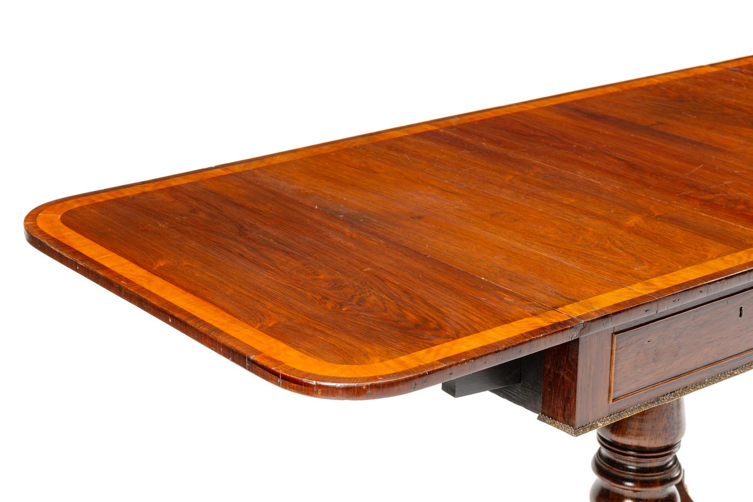 A Regency Gilt Bronze Mounted Satinwood-Banded Mahogany Sofa Table