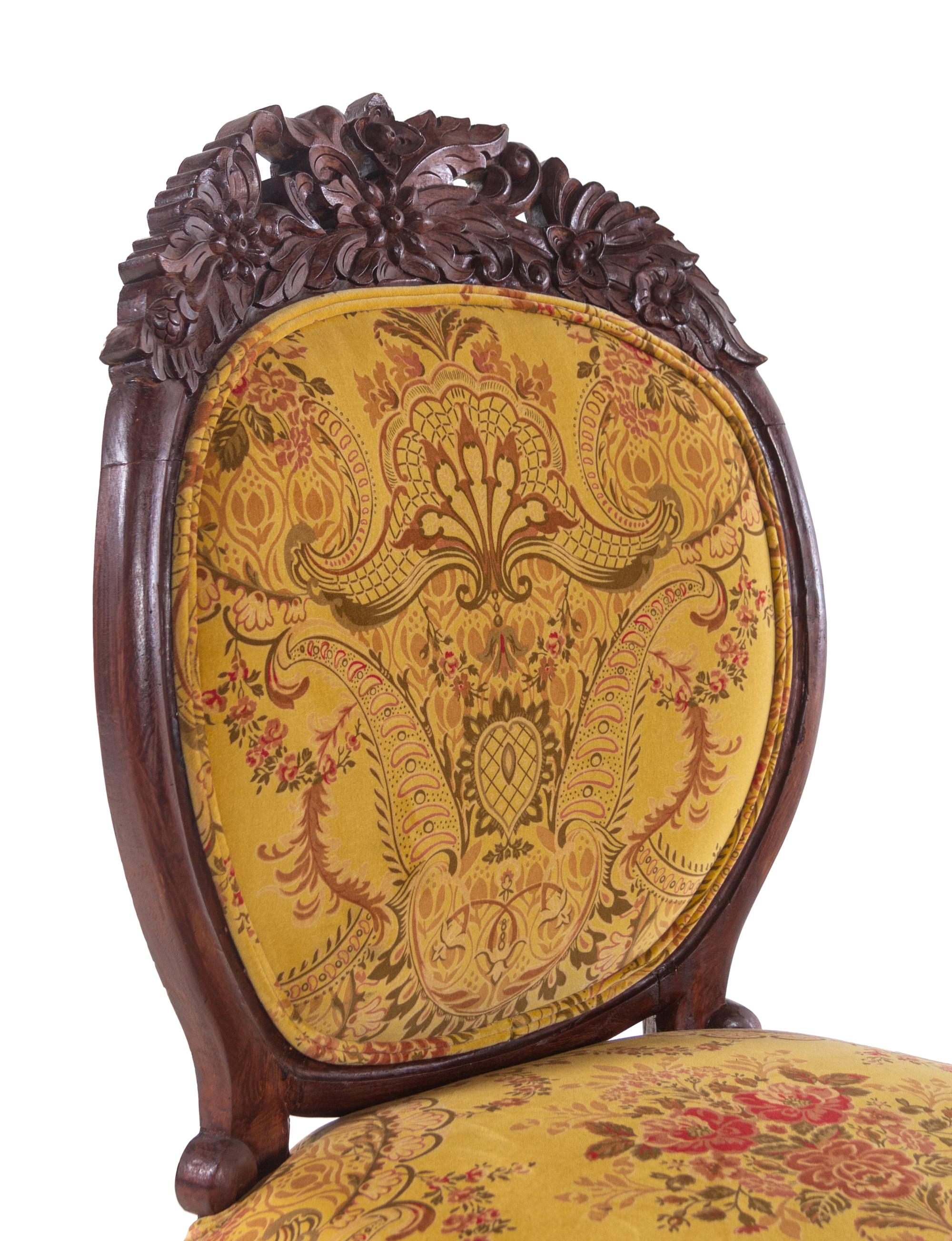 A Renaissance Revival Carved Walnut Breakfast Table and Chairs