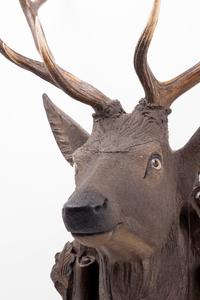 A Black Forest Carved Stag Head