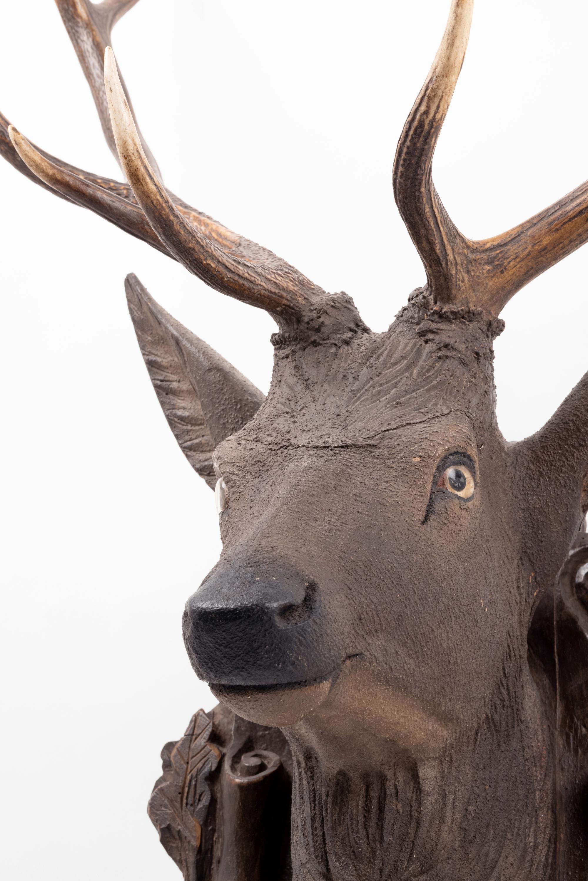 A Black Forest Carved Stag Head