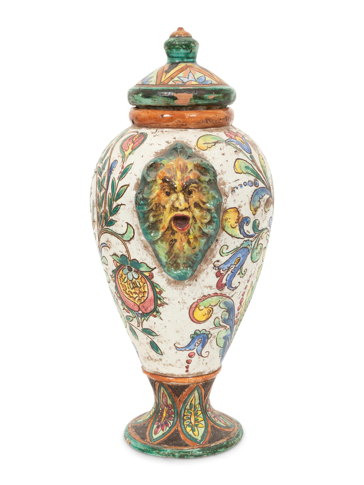 An Italian Majolica Covered Urn with Lion Mask Handles