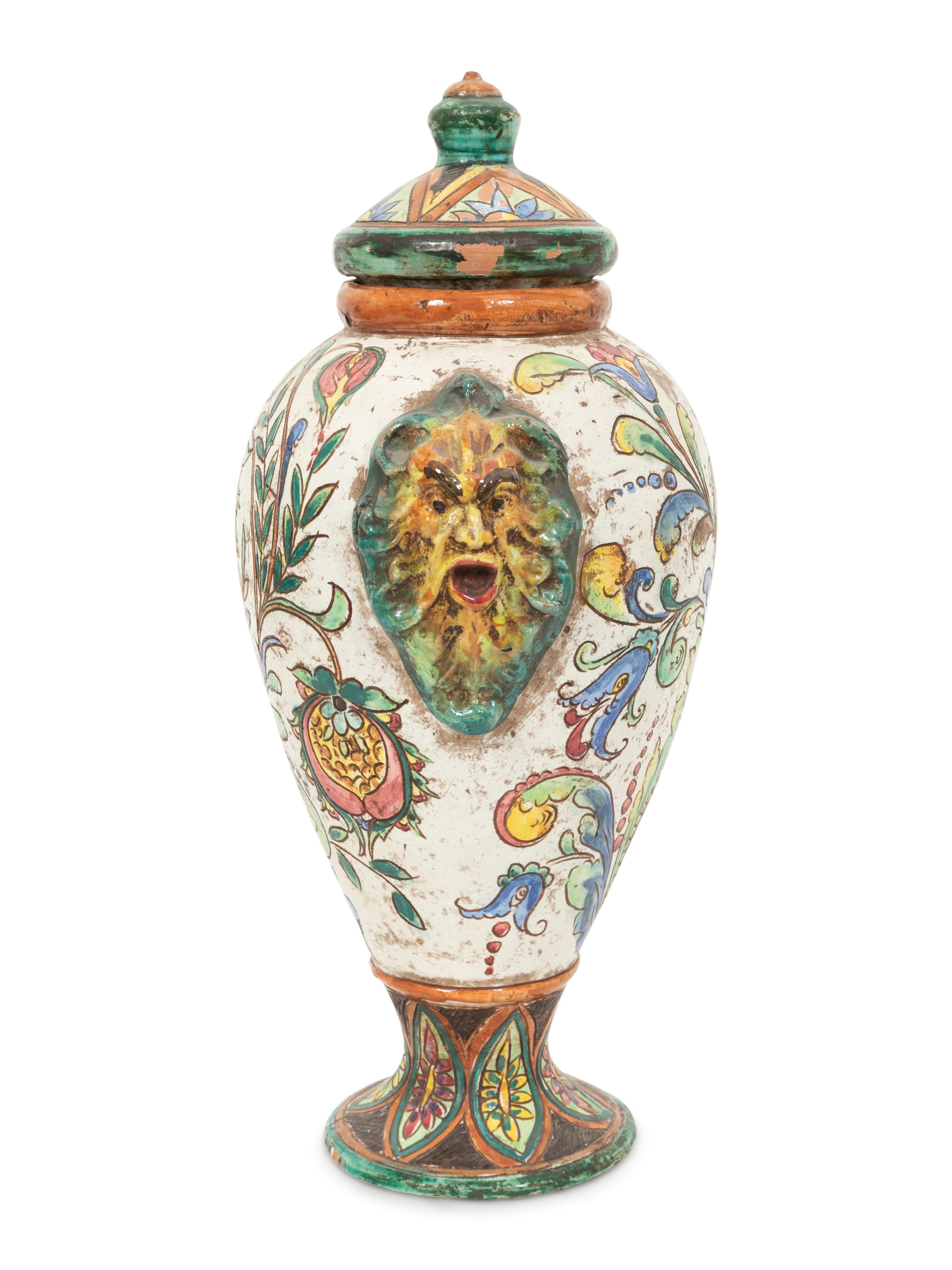 An Italian Majolica Covered Urn with Lion Mask Handles