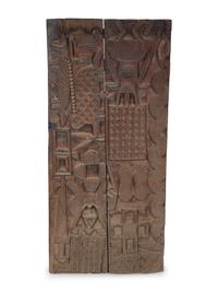 An African Carved Wood Panel — 20TH CENTURY