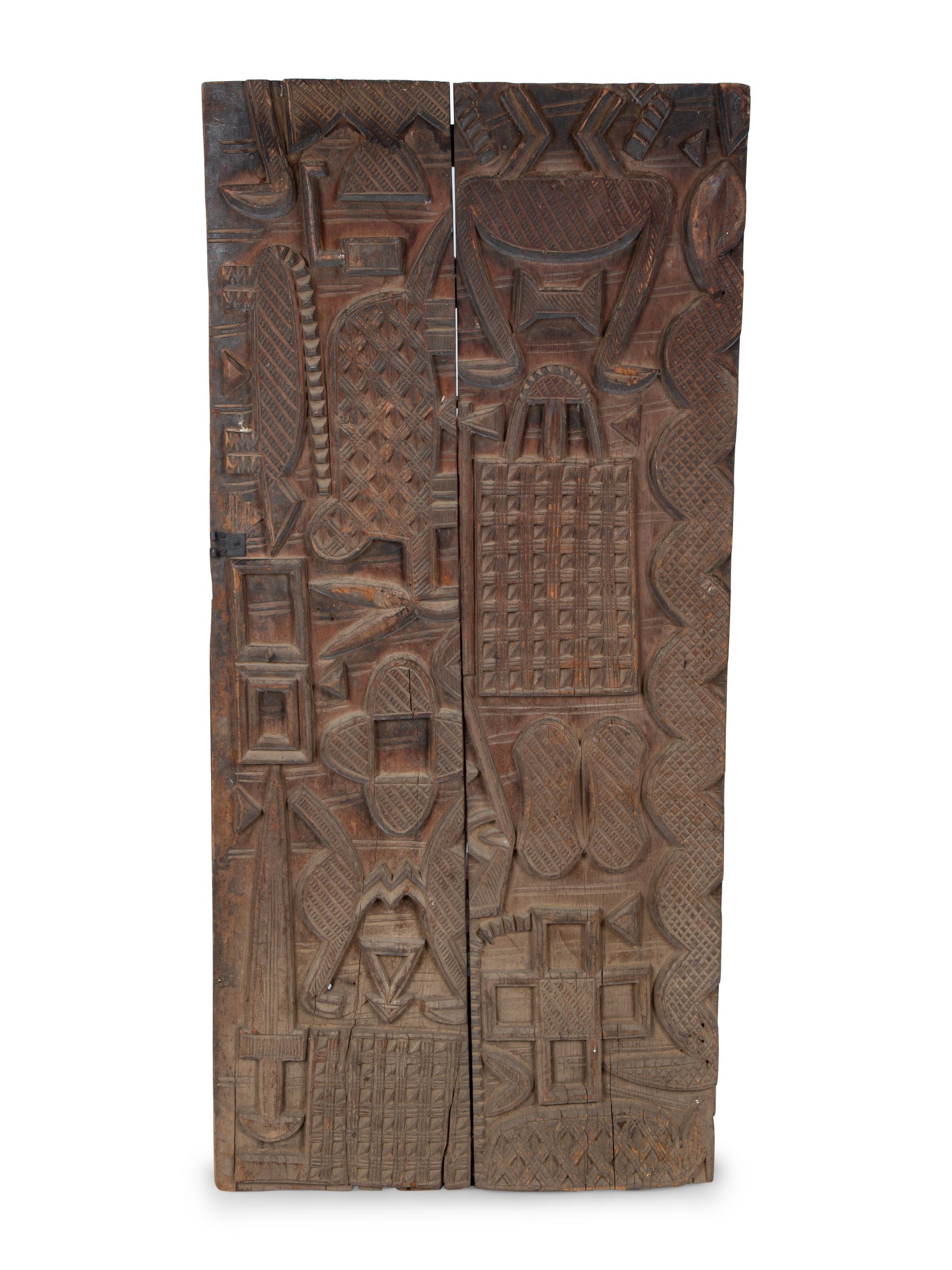 An African Carved Wood Panel — 20TH CENTURY