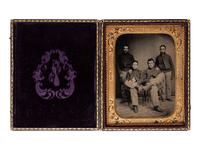 [CIVIL WAR]. Half plate ruby ambrotype of four cavalrymen or artillerymen.
