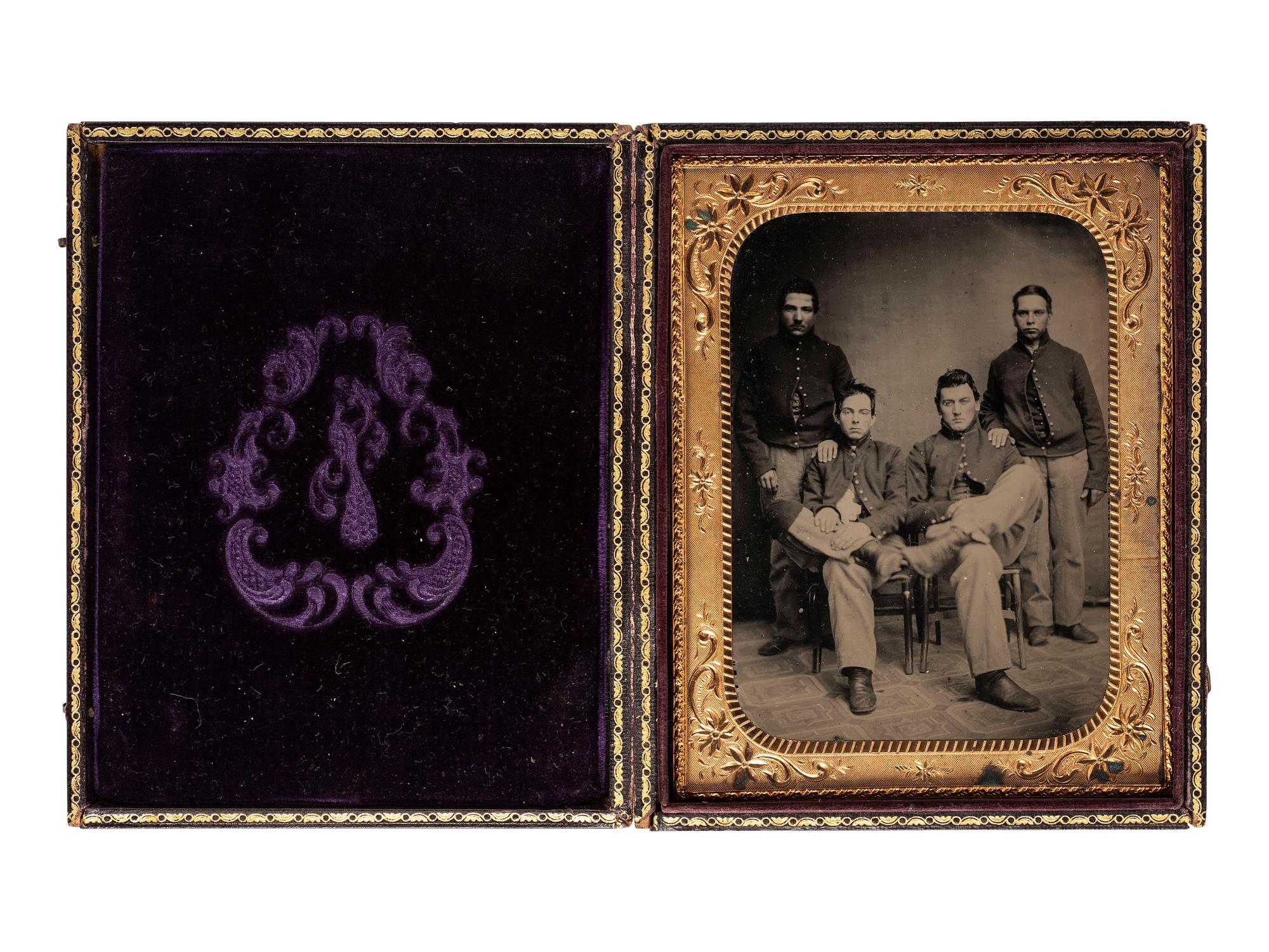 [CIVIL WAR]. Half plate ruby ambrotype of four cavalrymen or artillerymen.