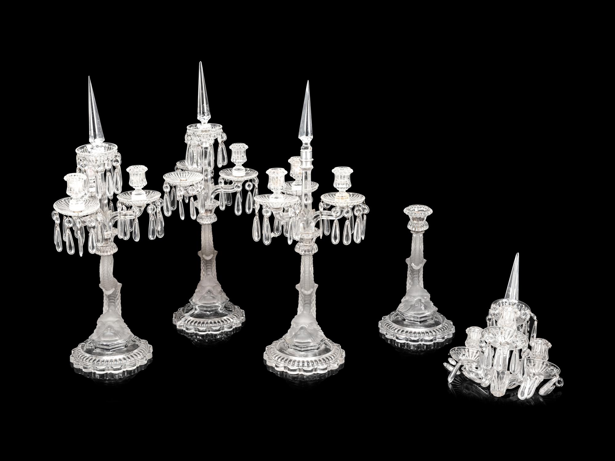 A Set of Four Baccarat Dauphin Three-Light Candelabra