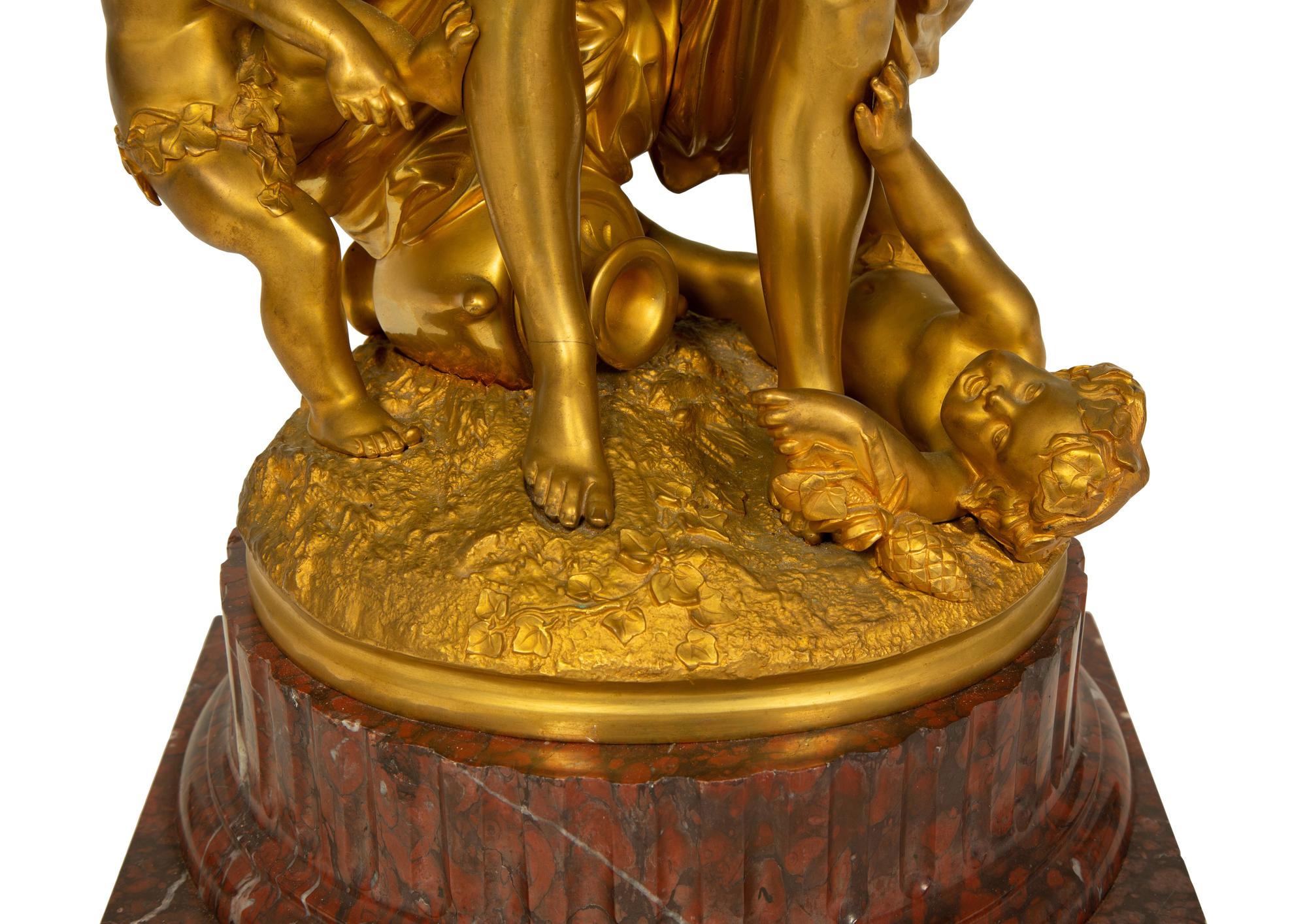 A Gilt Bronze Figural Bacchanalia Group, After Michel Claude Clodion (French, 1738-1814) — 19TH CENTURY