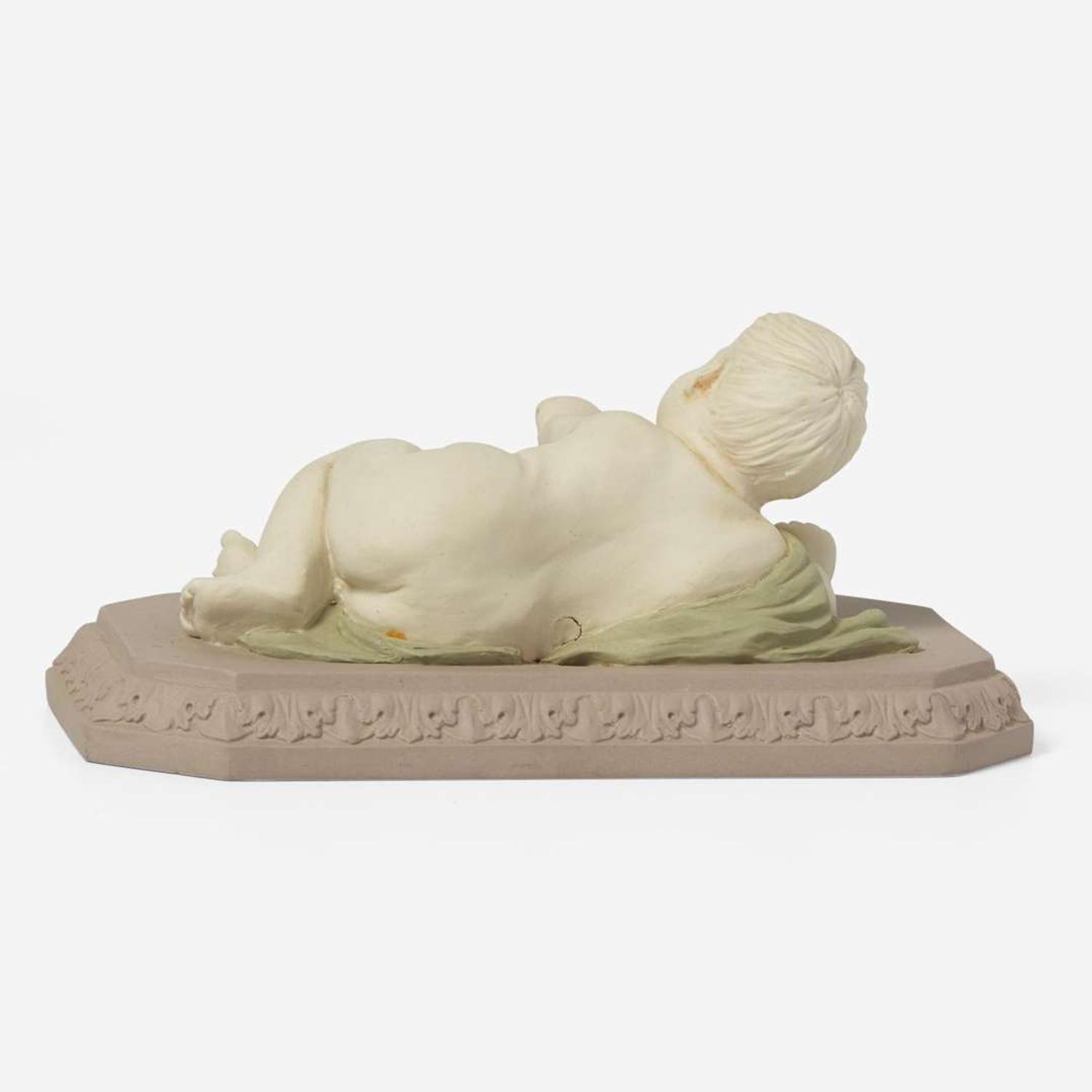 A Wedgwood Tricolor Jasperware Figure of a Reclining Infant UK, circa 1800