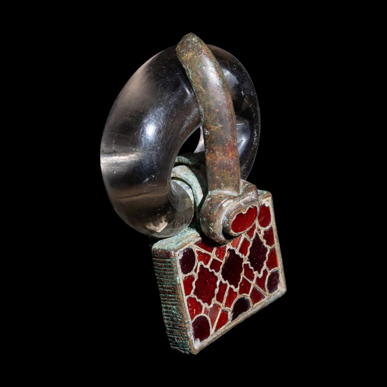 A Merovingian Bronze, Rock Crystal, and Garnet Belt Buckle