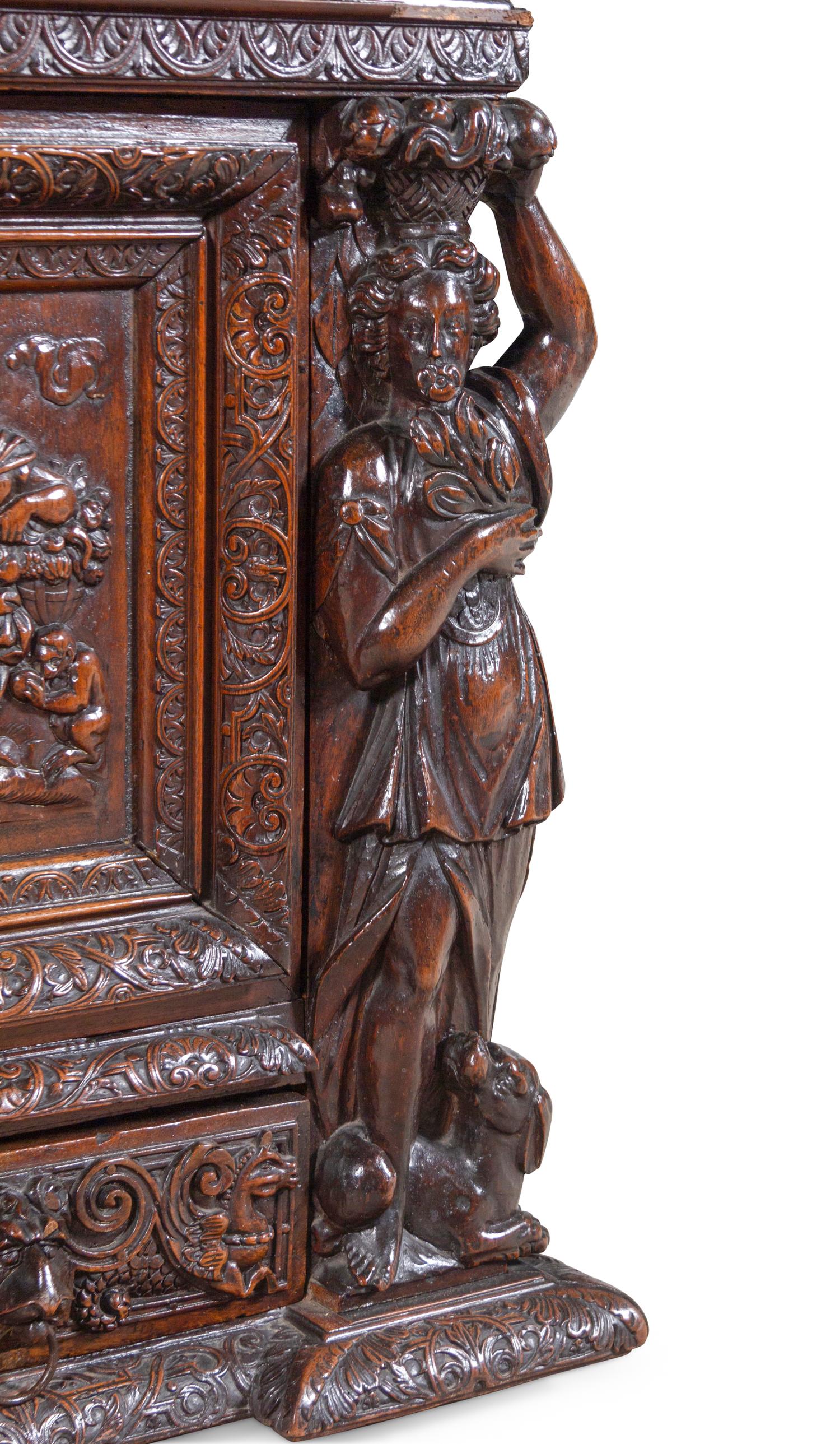 A Renaissance Revival Carved Walnut Marble-Top Cabinet