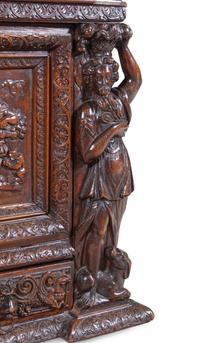 A Renaissance Revival Carved Walnut Marble-Top Cabinet